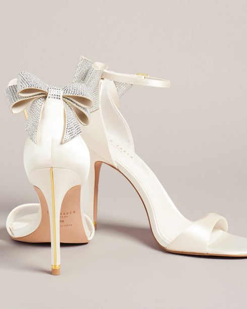 HEMARY-Sandals-We've made the perfect party shoe with HEMARY. With a stiletto heel and crystal embellished bow at the back, these satin sandals are as elegant as they are daring. Slip into the slim open toe strap and secure the buckle ankle fastening, and you're ready to dance the night away. Heeled sandals Satin finish Crystal bow embellishment Open toe Slim toe strap Stiletto heel with golden detail Buckle ankle strap- Ted Baker Romania